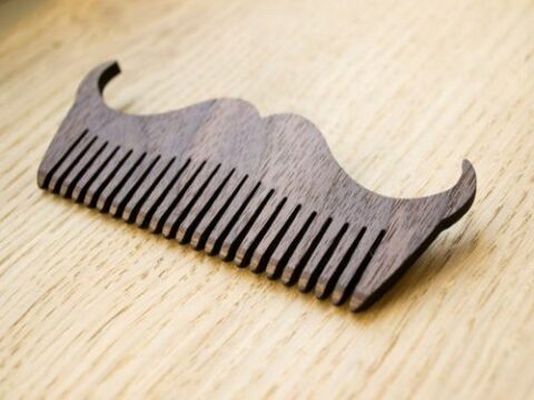 Laser Cut Mustache Shaped Comb Free Vector