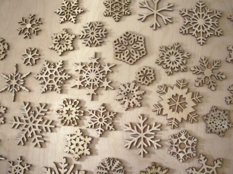 Laser Cut Wood Snowflake Ornaments Free Vector